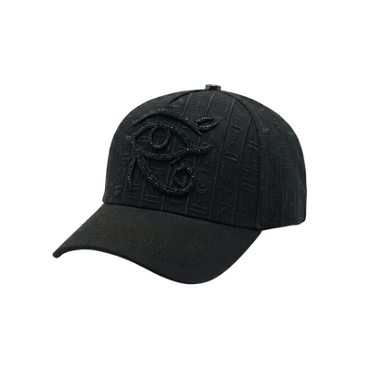 Gorra Xcalibur negra con símbolo de ojo bordado al frente, relieve monocromático con inspiración egipcia y acabado oscuro